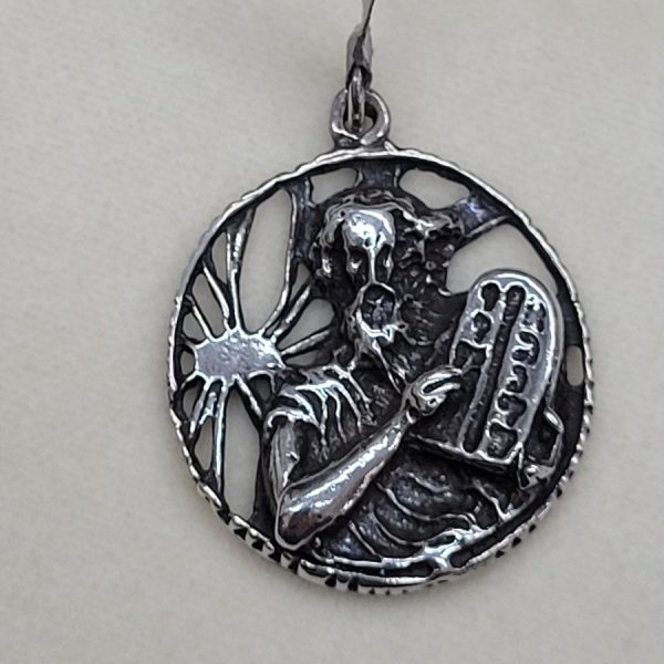 Handmade sterling silver Moses holding commandments pendant with the 10 Commandments in a round disk. Dimension diameter 2.7 cm X 0.5 cm approximately.