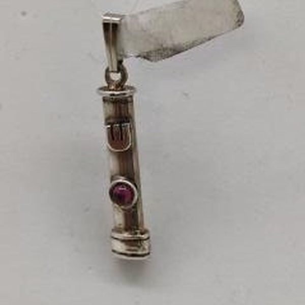 Handmade sterling silver Mezuzah pendant Garnet stone set in center made by S. Ghatan(Katan). Dimension 0.5 cm X 0.27 cm X 2.2 cm approximately.