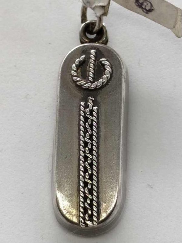 Sterling silver Mezuzah pendant ellipse filigree handmade with Yemenite filigree. Dimension 1 cm X 0.6 cm X 2.6 cm approximately.