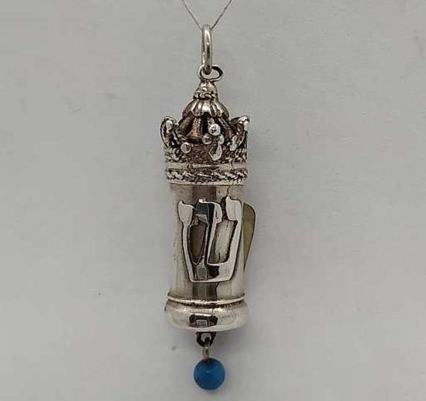 Handmade sterling silver Mezuzah pendant Turquoise bead hanging with Yemenite filigree design. Dimension diameter 1.1 cm X 0.6 cm X 3.6 cm approximately.