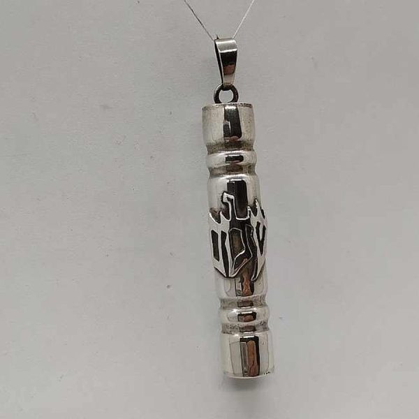 Handmade sterling silver Mezuzah pendant Shalom written Shalom in Hebrew on Mezuzah tube. Dimension diameter 1 cm X 5 cm approximately.