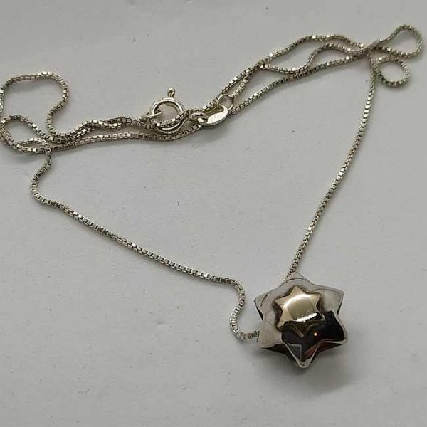 Handmade sterling silver & 14 carat gold Magen David Star 3 Dimension set with a mini 14 carat gold star of David on top.