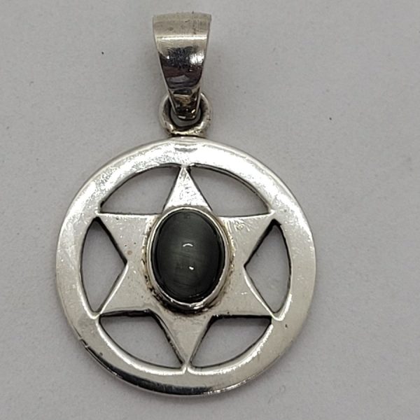 A simple sterling silver round shape with a MagenDavid Pendant Cats Eye set  in. Dimension diameter 1.8 cm X 0.5 cm approximately.