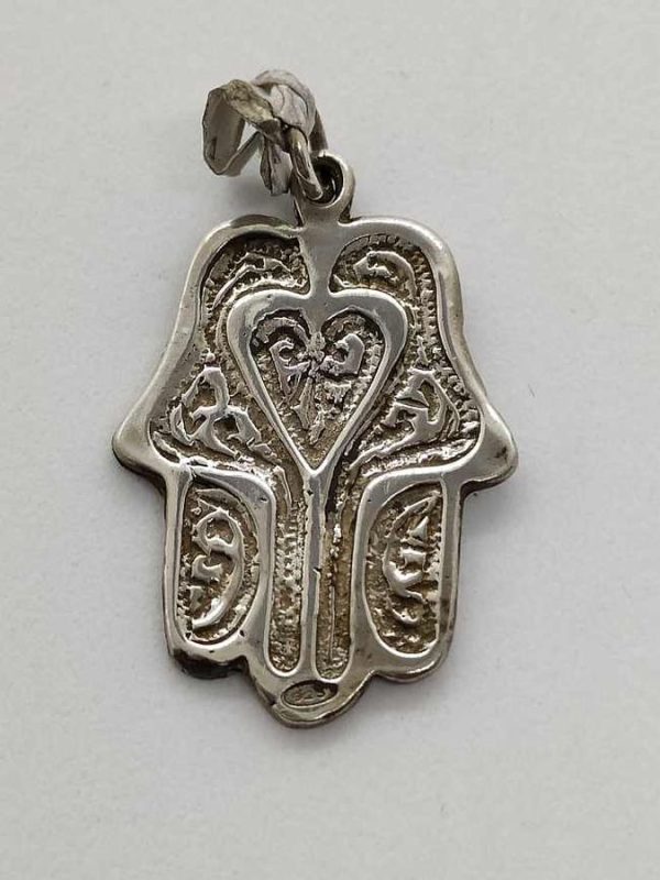 Handmade sterling silver Hamsa Chamsa pendant heart shape hand engraved in heavy solid silver. Dimension 2 cm X 2.7 cm X 0.12 cm approximately.