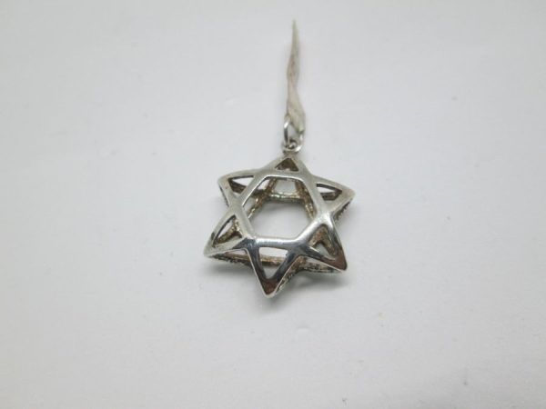 Sterling silver doubled MagenDavid star pendant double sided 3 dimension traditional shape. Dimension 1.7 cm X 2 cm X 0.65 approximately.