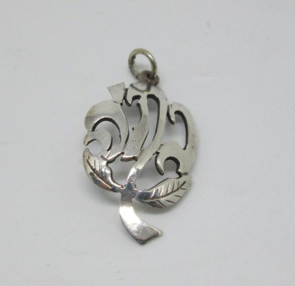 You can order sterling silver name pendant rose flower shape with your Hebrew name pendant by request. Dimension 1.5 cm X 2.5 cm approximately