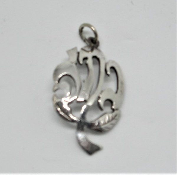 You can order sterling silver name pendant rose flower shape with your Hebrew name pendant by request. Dimension 1.5 cm X 2.5 cm approximately