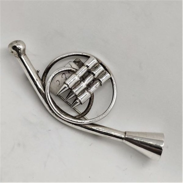Handmade sterling silver French Horn Miniature Sculpture brooch. I have in stock music instruments violin , guitar, saxophone and many more.