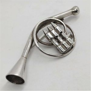 Handmade sterling silver French Horn Miniature Sculpture brooch. I have in stock music instruments violin , guitar, saxophone and many more .