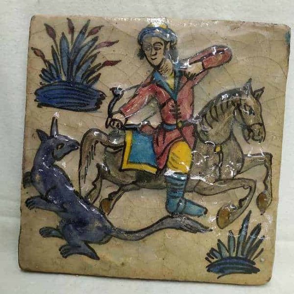 Glazed Ceramic Tile Vintage Horseman Relief. Handmade glazed ceramic tile vintage made in Persia end of 19th century. A horseman hunting wolf relief design.