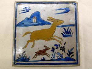 Glazed Ceramic Tile Vintage Two Young Deer Run. Handmade glazed ceramic tile vintage made in Persia early 20th century. A couple of young deers running .