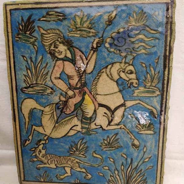 Glazed Ceramic Tile Vintage Horseman Hunting Wolf. Handmade glazed ceramic tile vintage made in Persia end of 19th century. A horseman hunting a wolf .