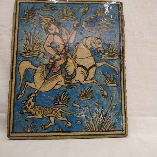 Glazed Ceramic Tile Vintage Horseman Hunting Wolf. Handmade glazed ceramic tile vintage made in Persia end of 19th century. A horseman hunting a wolf .