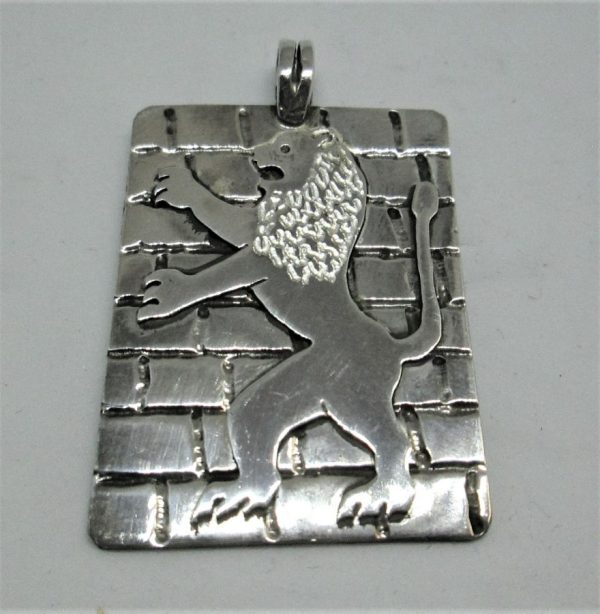 Handmade sterling silver Lion of Judea pendant symbol of Jerusalem on Kotel stones made by S. Ghatan. Dimension 2.7 cm X 3.6 cm X 1.6 cm approximately.