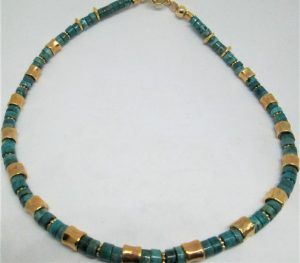 Handmade Cylinder Turquoise Beads Necklace with sterling silver gold plated beads. Dimension diameter 0.55 cm X 45 cm approximately.