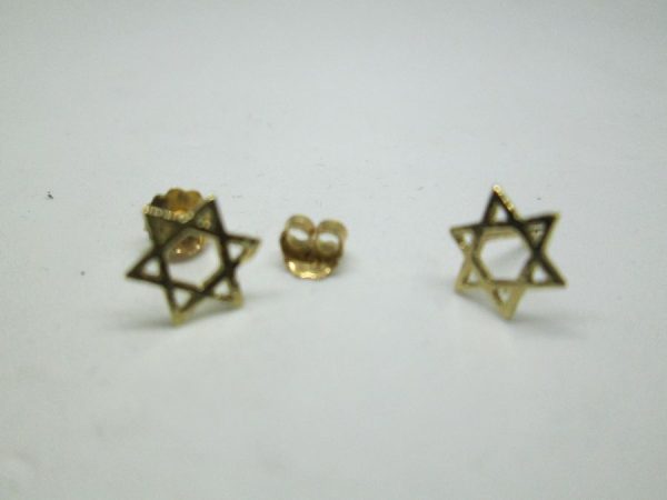Handmade 14 carat gold Magen David stud earrings cut out miniature size star of David design . Dimension 0.7 cm X 0.8 cm approximately.