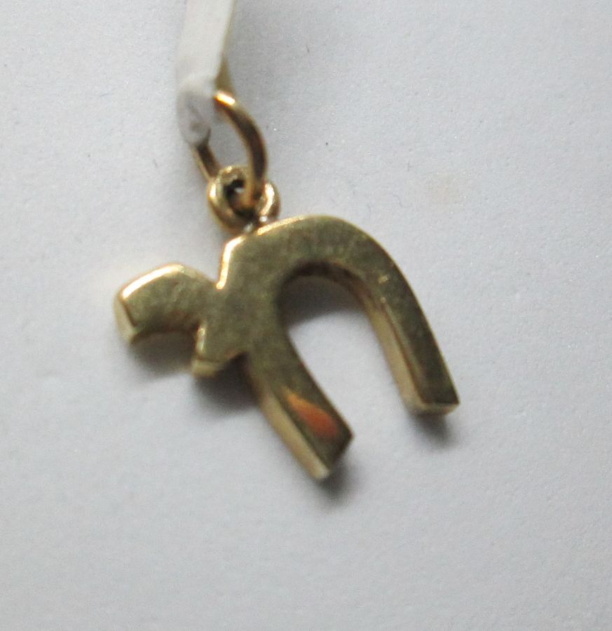 Chai pendants gold small Hay is heavy and suitable for Bar/ Bath Mitzvah gift. Dimension 1.25 cm X 1.1 X 0.2 cm approximately.