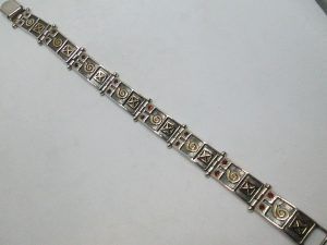 Handmade sterling silver & 14 carat yellow gold bracelet silver gold contemporary set with Garnet stones contemporary design.