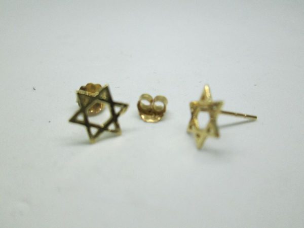 Handmade 14 carat gold Magen David stud earrings cut out miniature size star of David design . Dimension 0.7 cm X 0.8 cm approximately.