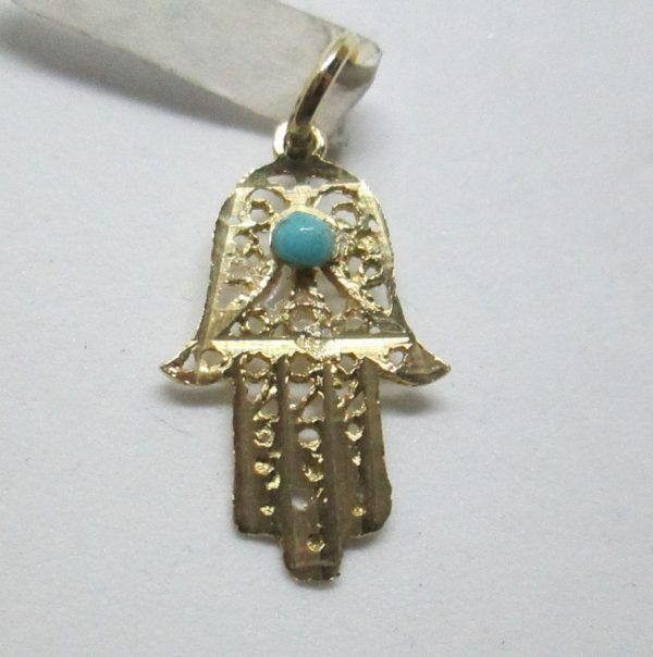 Handmade 14 carat gold Hamsa pendant filigree Turquoise Yemenite filigree set with Turquoise stone. Dimension 1.2 cm X 1.8 cm X 0.08 approximately.