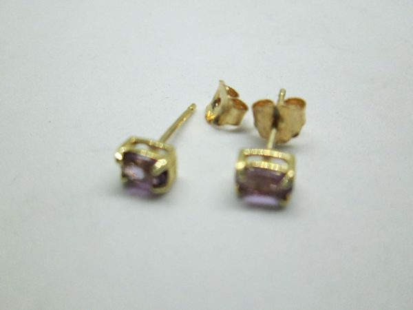 Handmade 14 carat gold stud earrings Amethysts stones set with two faceted Amethyst stones . Dimension 0.35 cm X 0.5 cm approximately.