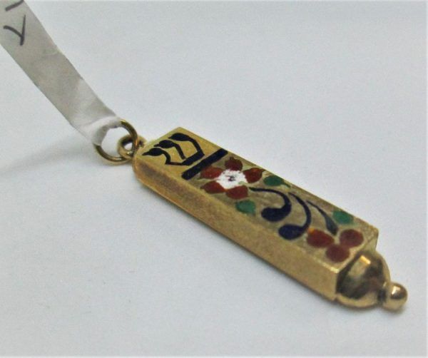 14 Carat gold Mezuzah pendant flowers enamel handmade 14 carat gold Mezuzah pendant with enameled flowers 0.7 cm X 3.3cm approximately.