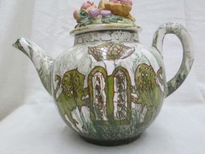 Handmade glazed ceramic tea pot lions illustrated with the lions of Judah & the 10 commandments. The cover has fruit & bread baskets made E. Ghatan