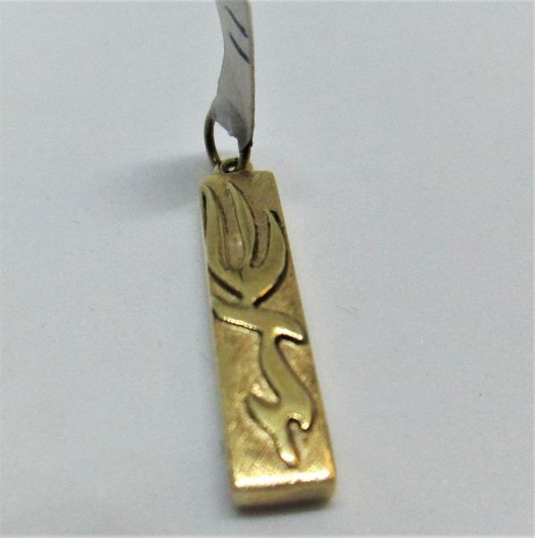 14 carat gold Mezuzah pendant raised letters Shaddai G-D's name in Hebrew letters. Dimension 0.6 cm X 2.5 cm approximately.