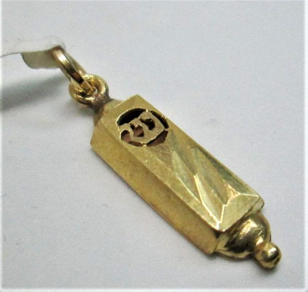 14 carat gold Mezuzah Pendant Cutout Shin and sand polish with diamond cut sparkles. Dimension 0.7 cm X 2.1 cm approximately.