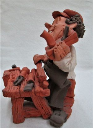 Handmade by Dennis Pottery Carpenter Sculpture. A traditional carpenter made by Dennis. Dimension 14 cm X 10.4 cm X 13.9 cm approximately.
