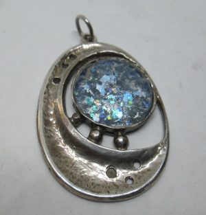 Handmade sterling silver Roman glass pendant motherhood design set with genuine Roman glass contemporary style 3.2 cm X 4.5 cm approximately.