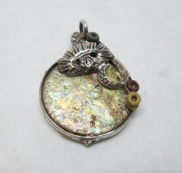 Handmade sterling silver Roman glass pendant flowers on top set with genuine Roman glass . Dimension 2.5 cm X 3.2 cm approximately.