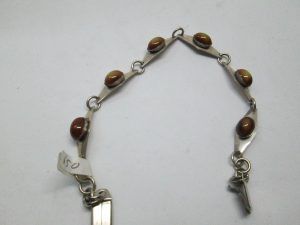 Handmade sterling silver bracelet Tiger Eye stones vintage from the 1960's set with tiger eyes stones. Dimension 0.8 cm X 18.4 approximately.