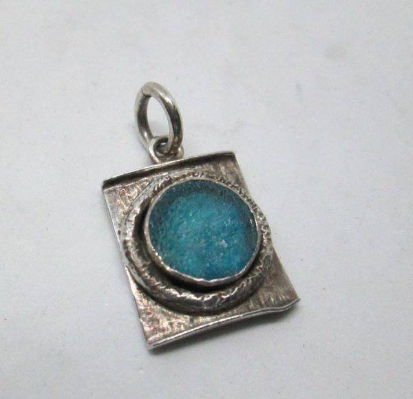 Handmade sterling silver Roman glass rectangular pendant shape set with round genuine Roman glass contemporary style 1.6 cm X 1.8 cm approximately.