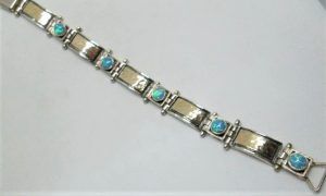 Handmade sterling silver Opal bracelet set with Opal stones contemporary design. Dimension 1 cm X 18.5 cm approximately.