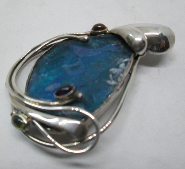 Handmade sterling silver abstract Roman glass pendant set with genuine Roman glass contemporary style made by T Perez 3.9 cm X 6.6 cm approximately.