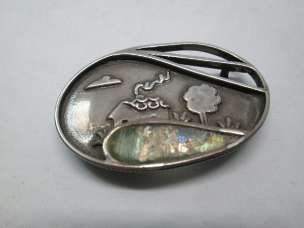Handmade sterling silver Roman glass pin ellipse shape set with genuine Roman glass. Dimension 2.7 cm X 4.1 cm approximately.