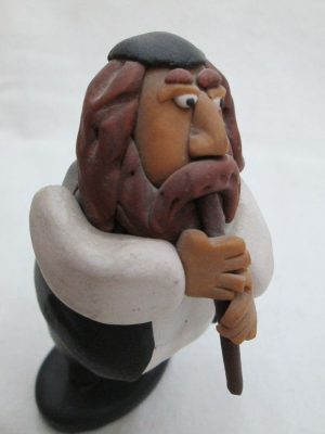 Handmade humoristic fimo ceramic a Shabby Rabbi playing flute made by Yuri. Dimension 10.7 cm X 5.8 cm X 4.2 cm approximately.