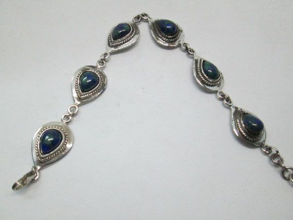 Sterling silver bracelet Azurite drops silver handmade set with cabochon Azurite stones. Dimension 1.4 cm X 20.5 cm approximately.