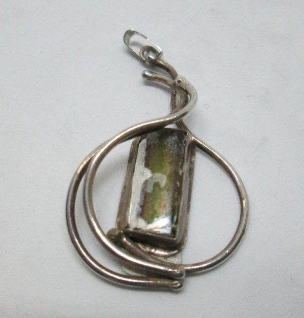 Handmade sterling silver Roman glass wire pendant set with genuine Roman glass and silver wires. Dimension 2.5 cm X 3.7 cm approximately.