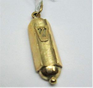 Handmade 14 carat yellow gold Mezuzah pendant Shin raised letter white gold. Dimension 0.8 cm X 2.5 cm approximately.