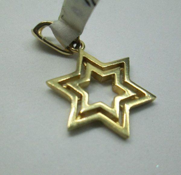 Handmade contemporary 14 carat gold two Magen David stars designed in one single pendant 1.5 cm X 1.7 cm X 0.2 cm approximately.