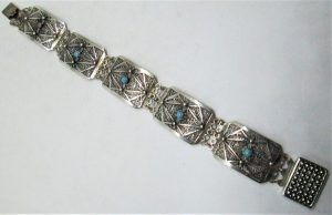 Vintage handmade sterling silver bracelet Yemenite filigree set with genuine Turquoises stones. Dimension 1.9 cm X 19.2 cm approximately.