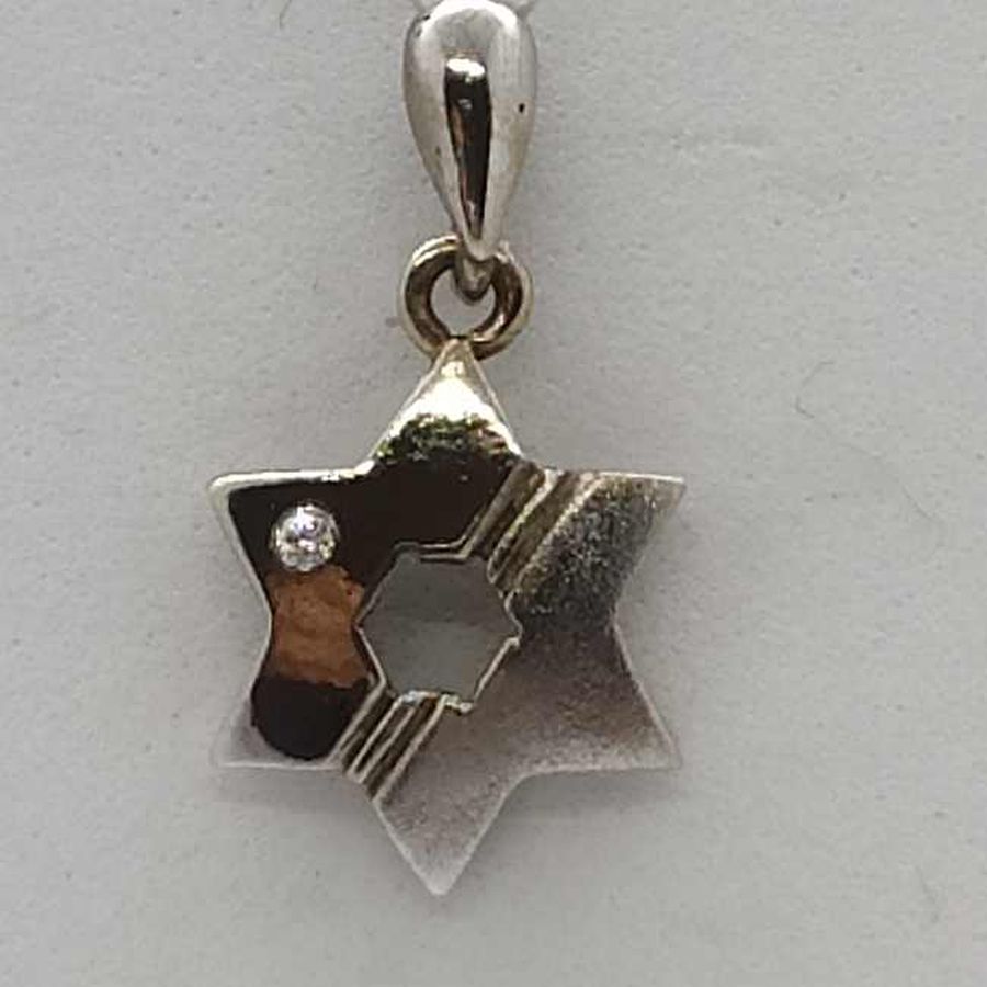 Handmade 14 carat white gold star MagenDavid pendant white gold set with white cubic Zircon stone 1.1 cm X 1.3 cm X 0.2 cm approximately.