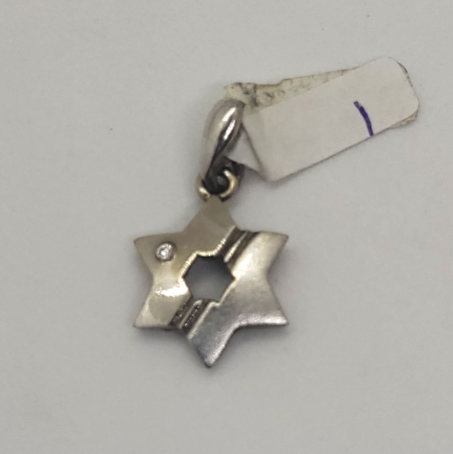 Handmade 14 carat white gold star MagenDavid pendant white gold set with white cubic Zircon stone 1.1 cm X 1.3 cm X 0.2 cm approximately.