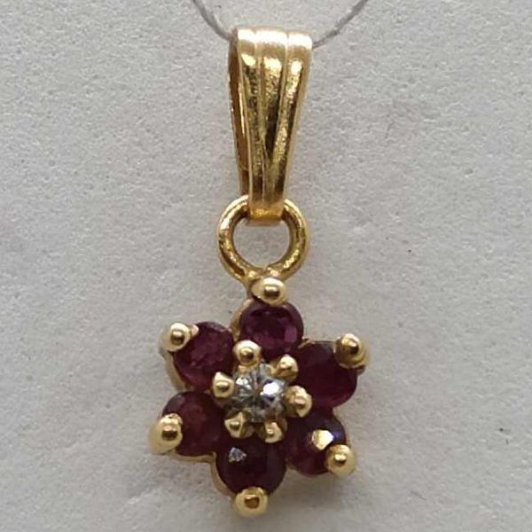 14 carat yellow gold star Magen David Diamond Rubies pendant set with a genuine white diamond 4 pts & 6 rubies, 0.6 cm X 0.7 cm X 0.03 cm.