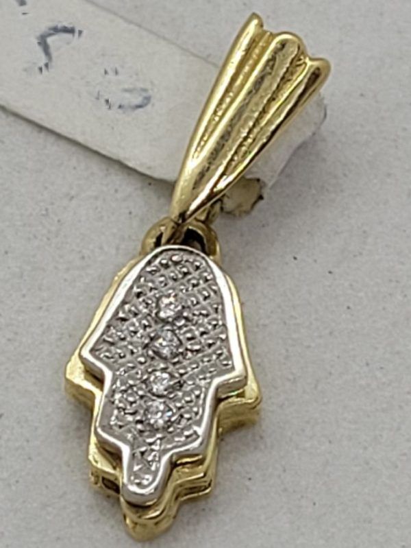 Handmade 14 carat gold Hamsa Pendant 4 Zirconia set with 4 White Zirconia stones. Dimension 0.7 cm X 1.1 cm X 0.3 approximately.