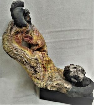 S. Factor has made this beautiful glazed ceramic sculpture in Roku ceramic a shabby clown resting, enjoying the sun, 25 cm X 15.8 cm X 23 cm.