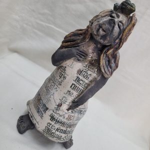 Handmade glazed Roku Ceramic Miss Piggy with a frog lying on her head, after she made her beloved charming prince into a frog made by S. Factor .