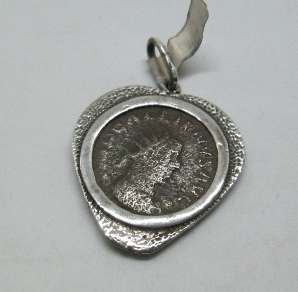Silver Pendant Heart Shape set with coin. Sterling silver pendant heart shape set with genuine antique Roman coin from the fifth century AD.